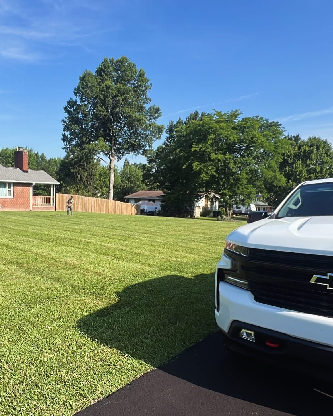 Maintained lawn beside Ohio Roots work truck